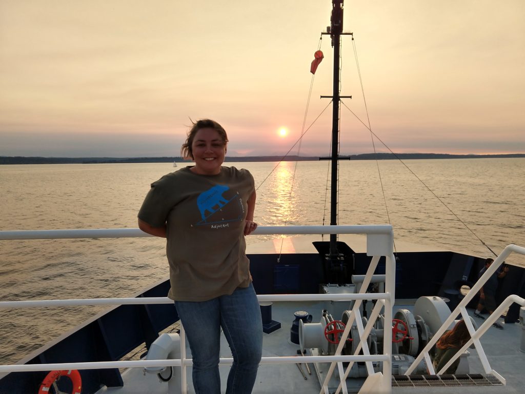 Abigale Wyatt with crewmates enjoying a sunset aboard the R/V Sally Ride. Credits: Abigale Wyatt