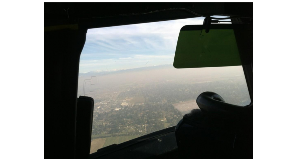 Reporter Tim Sheehan of the Fresno Bee took this photo through the NASA P-3B's cock-pit window as they flew over Fresno, Calif. on Jan. 22, showing a very hazy atmosphere over the area.
