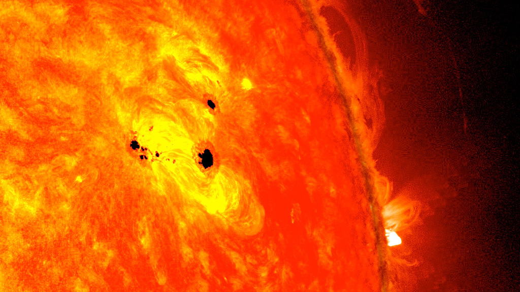 SDO captured this image of sunspots in February 2013. The bottom two clusters appeared over the course of two days and are over six Earths across. Credit: NASA's Goddard Space Flight Center Images courtesy of NASA/SDO