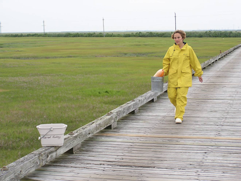 Individual walking down pier