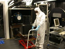 Gatebe preparing the CAR instrument (on the cart) for calibration with an integrating sphere in Goddard's Calibration Facility in Building 33. Image Credit: Courtesy of C. Gatebe