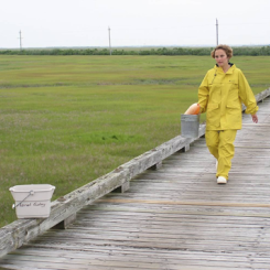Individual walking down pier